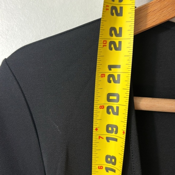 DKNY black classic wraparound top in size medium. - Picture 6 of 6